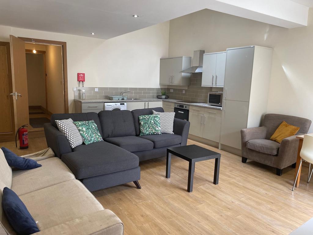 Bright and spacious living room featuring moder...