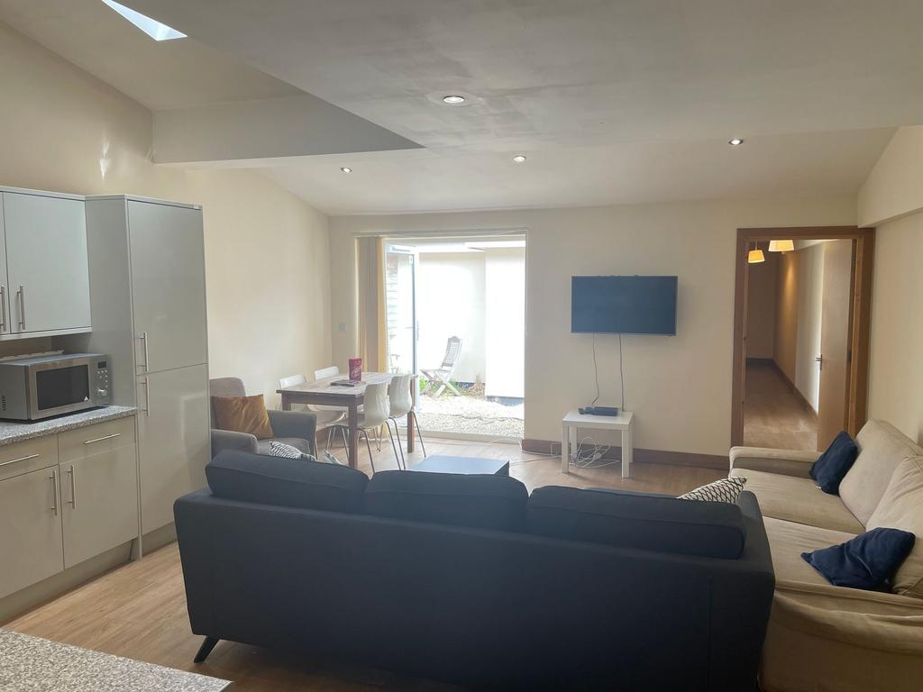 Bright and spacious living area featuring moder...