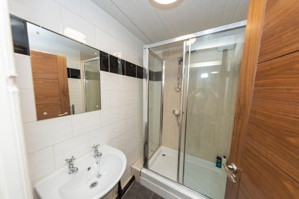 A clean and well-maintained bathroom featuring ...
