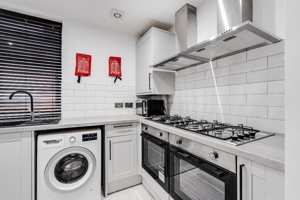 Modern and well-maintained kitchen featuring sl...