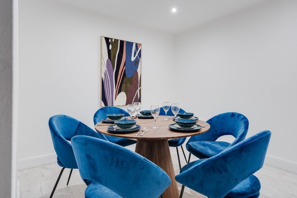 A stylish and modern living room featuring a co...