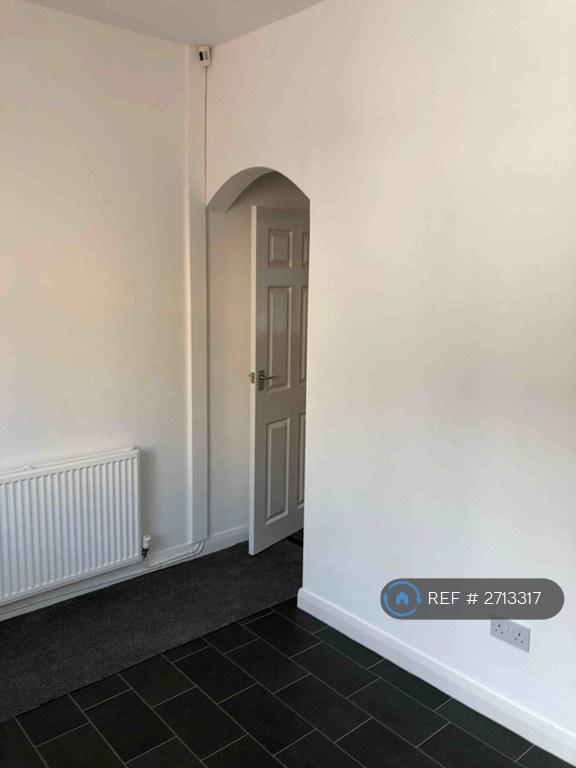 Archway With Door To Stairs &amp; Front Living Room