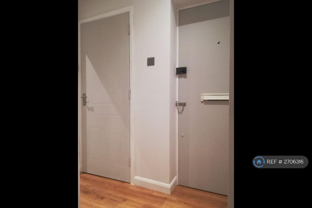 Front Door With Storage Room To The Left