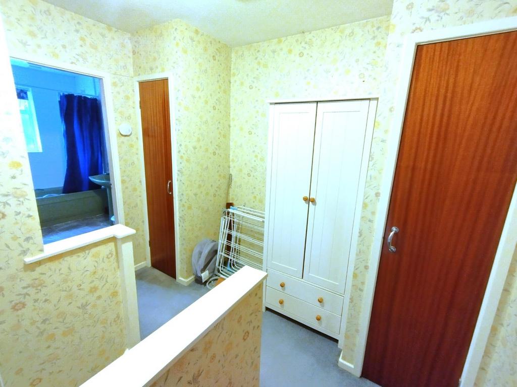 Bright landing with floral wallpaper, built-in ...