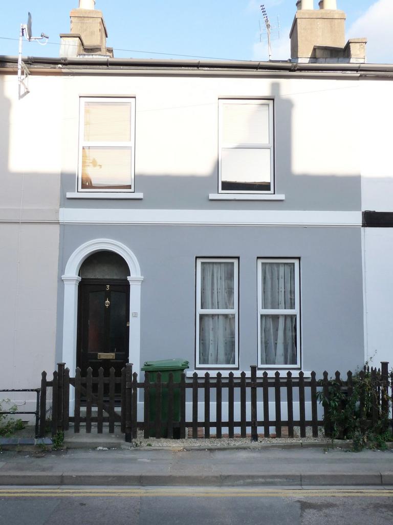 Well-presented terraced house with a neat paint...