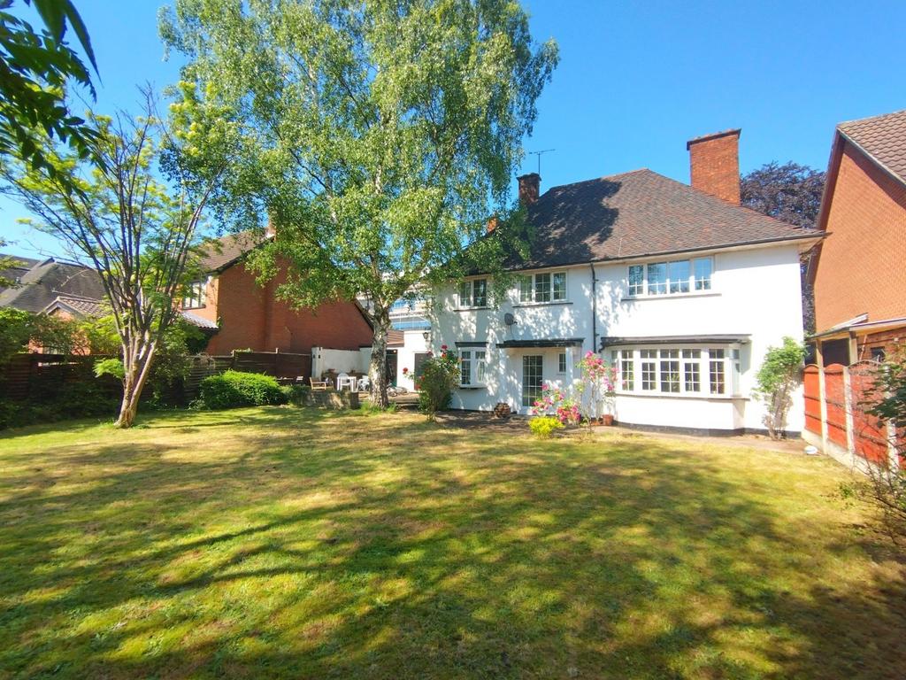 Sunny private rear garden with a large lawn, ma...