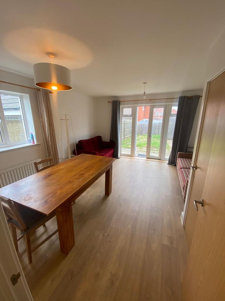 Bright and inviting living room with ample natu...