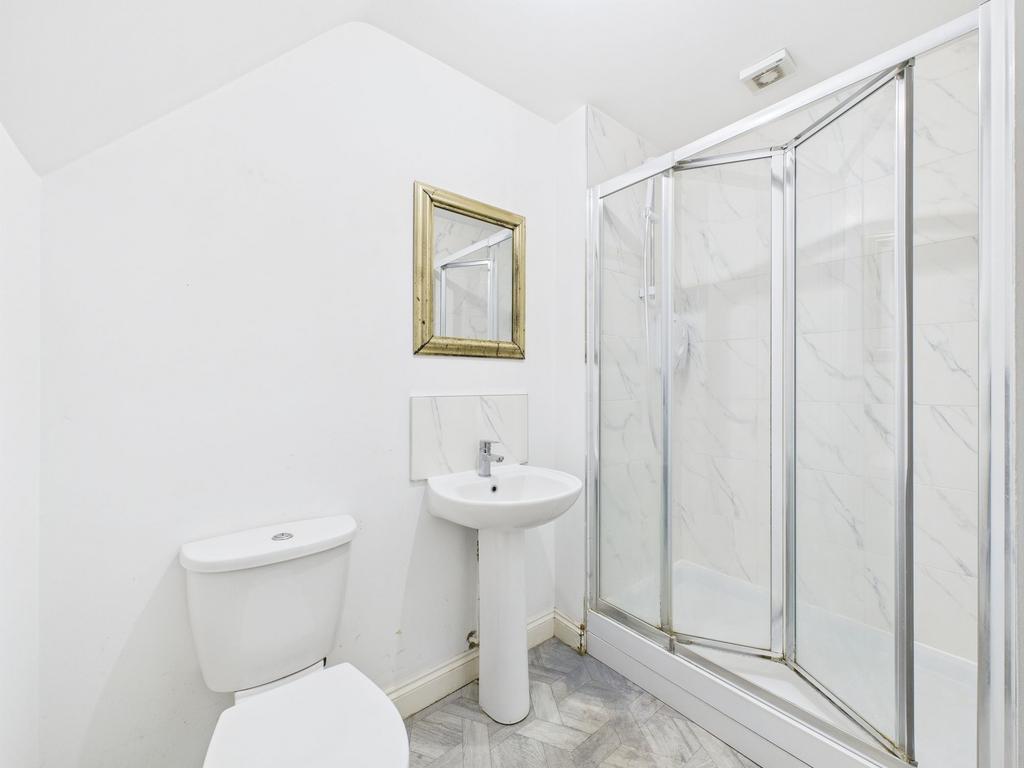 A bright and clean bathroom featuring a WC, a s...