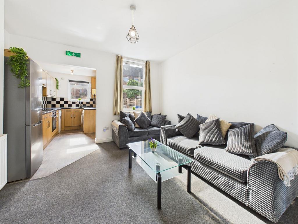 Bright and welcoming living room with large win...