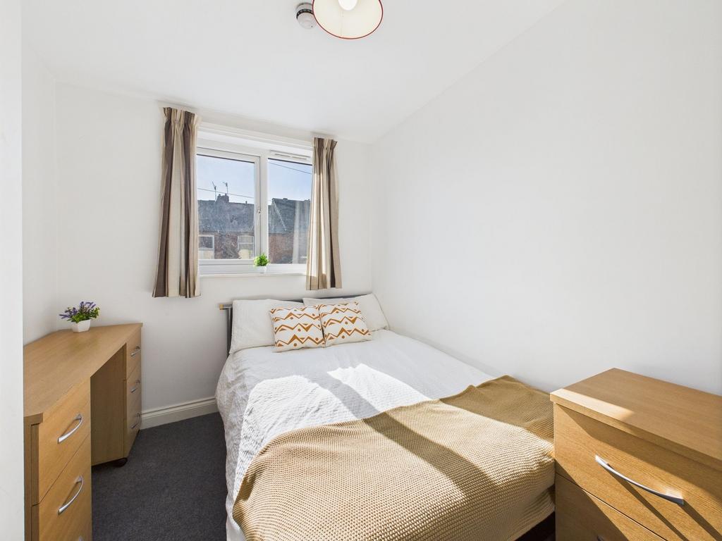 Bright and airy bedroom featuring a double bed ...