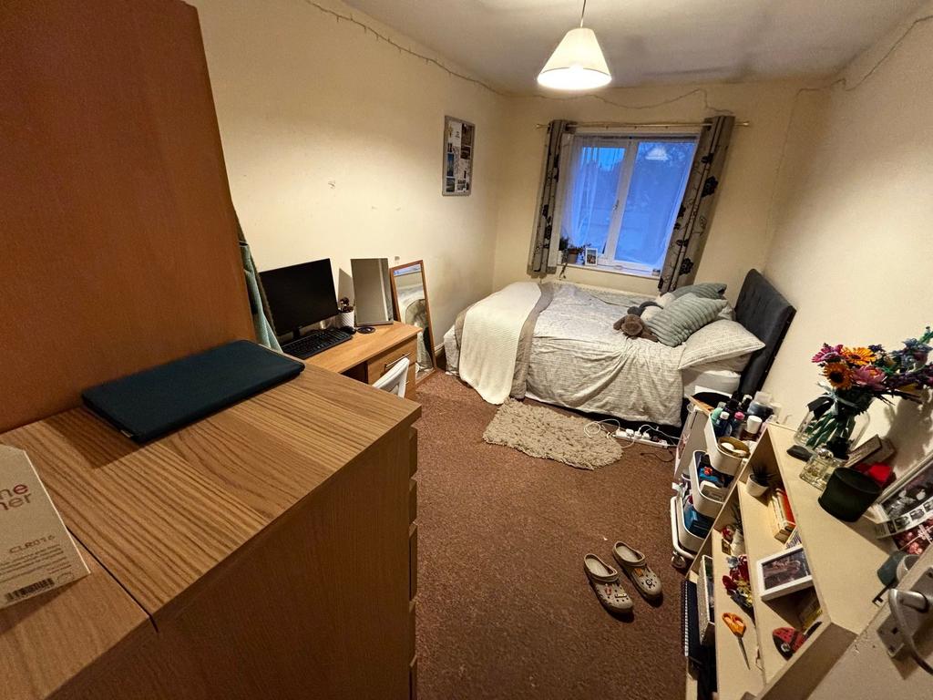 Bright, well-appointed bedroom with a double be...