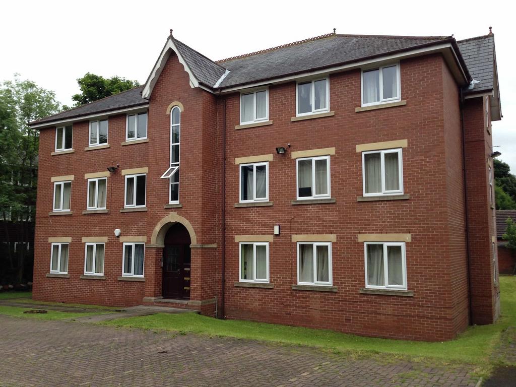 A charming brick building with a well-maintaine...