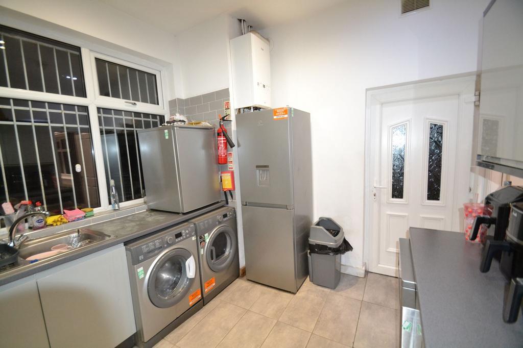 Bright, modern kitchen with stainless-steel app...