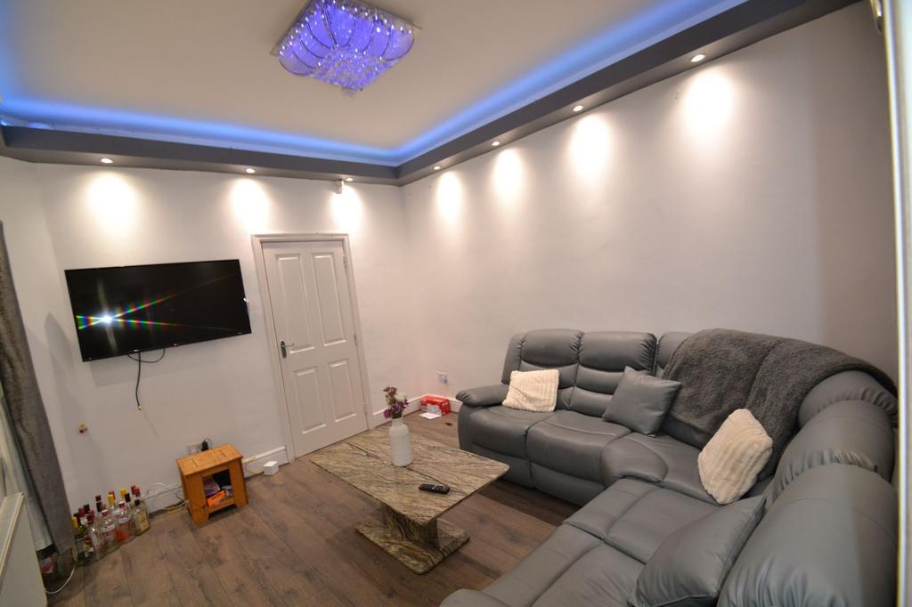 Contemporary living room with a comfortable gre...