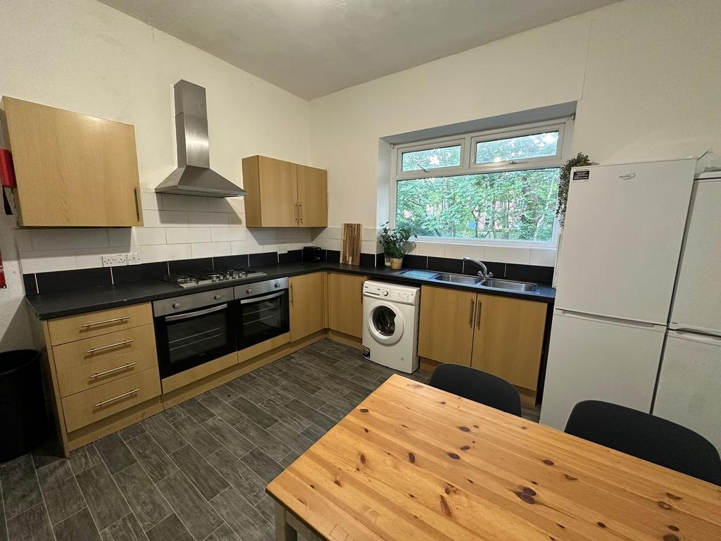 A bright and well-maintained kitchen with moder...