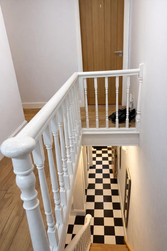 Bright, freshly painted stairwell with classic ...