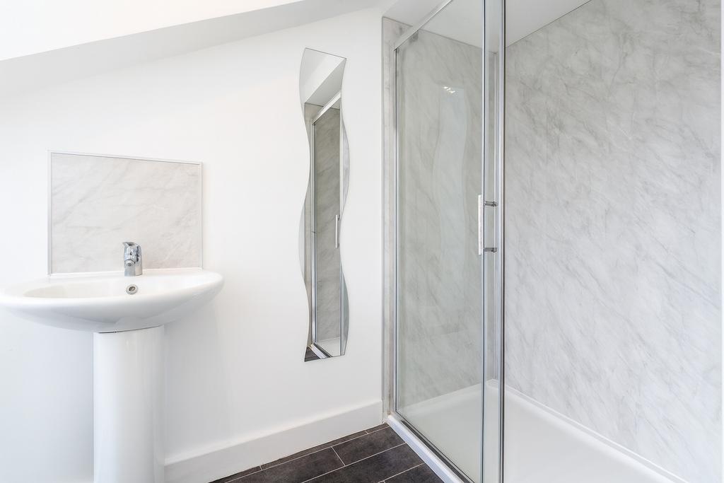 Modern bathroom featuring a sleek sink with a m...