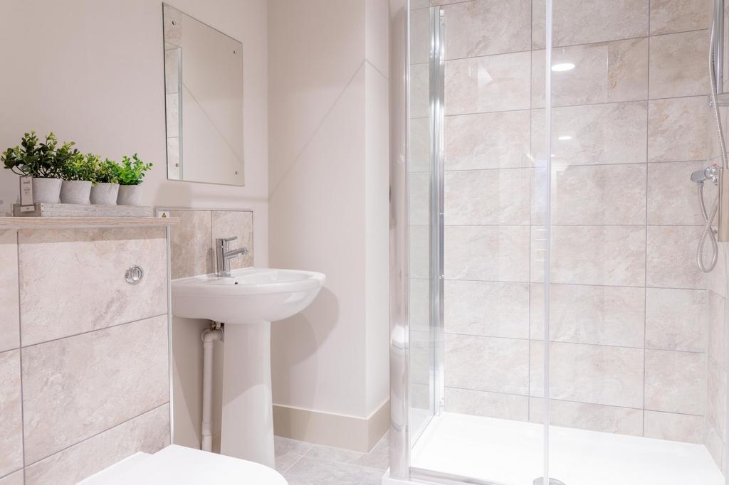 Bright, modern bathroom with a walk-in shower, ...
