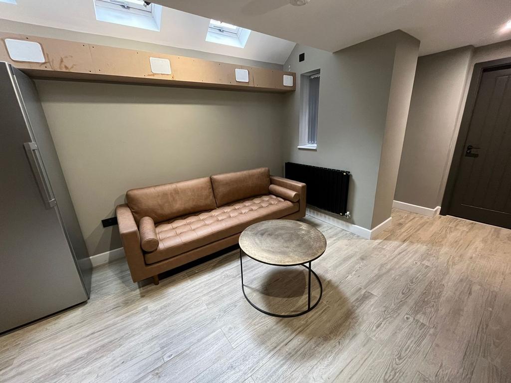 Contemporary ground-floor living area with a le...