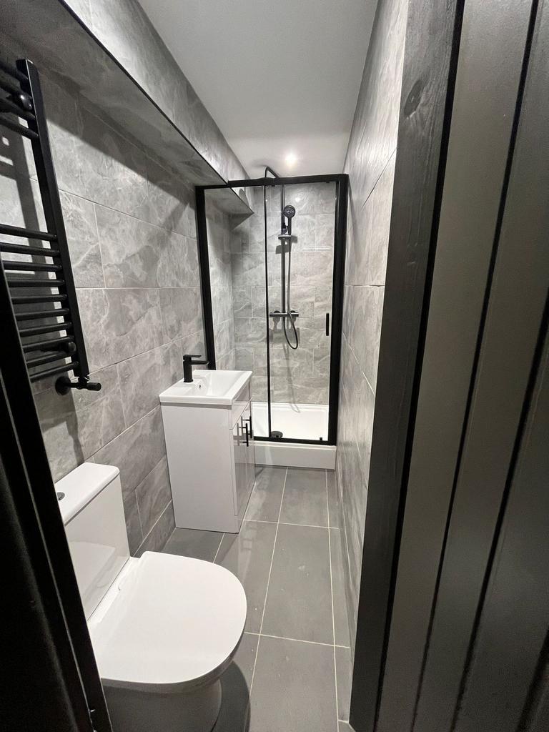 Contemporary tiled bathroom with a walk-in show...