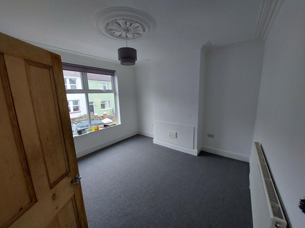 Bright, freshly painted double bedroom with a l...