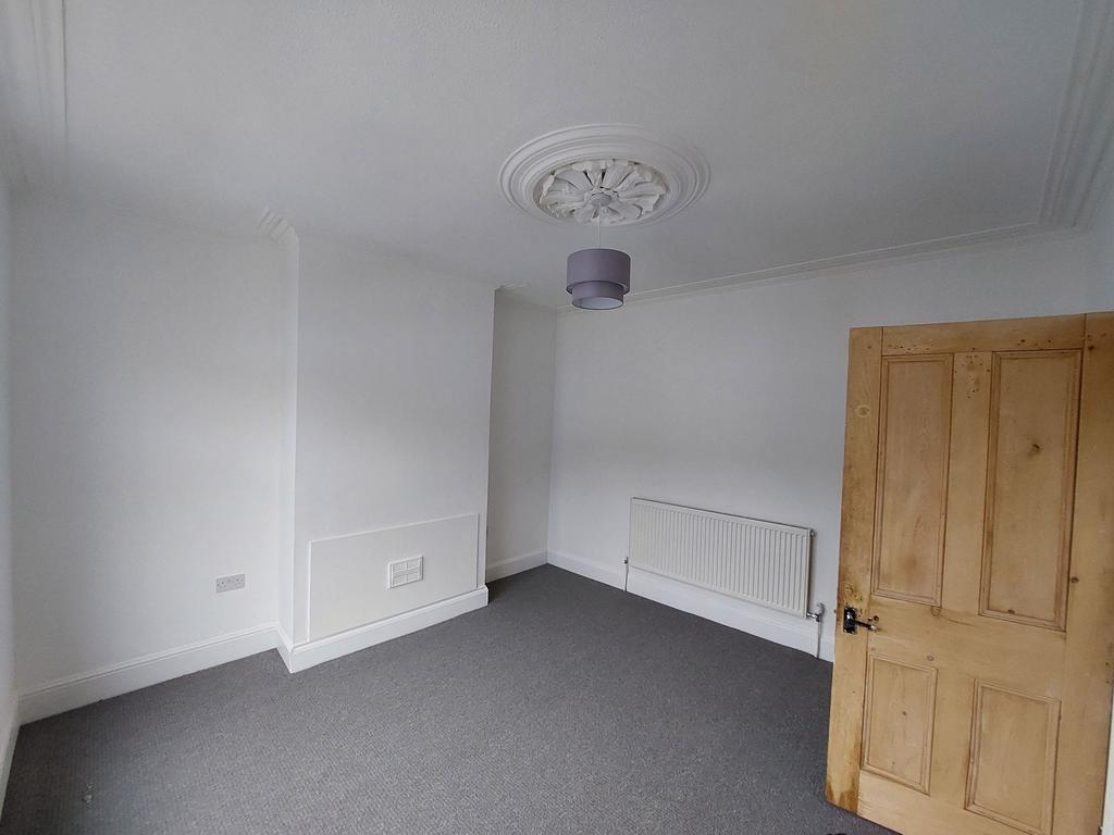 Bright, neutral bedroom with fresh white walls,...
