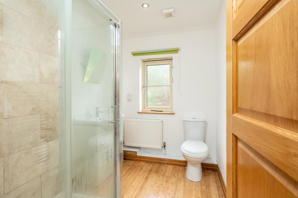 A bright and spacious en-suite with a large shower