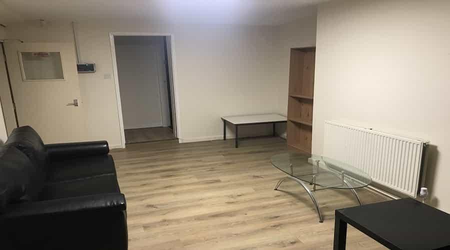 Spacious, well-maintained living room with mode...