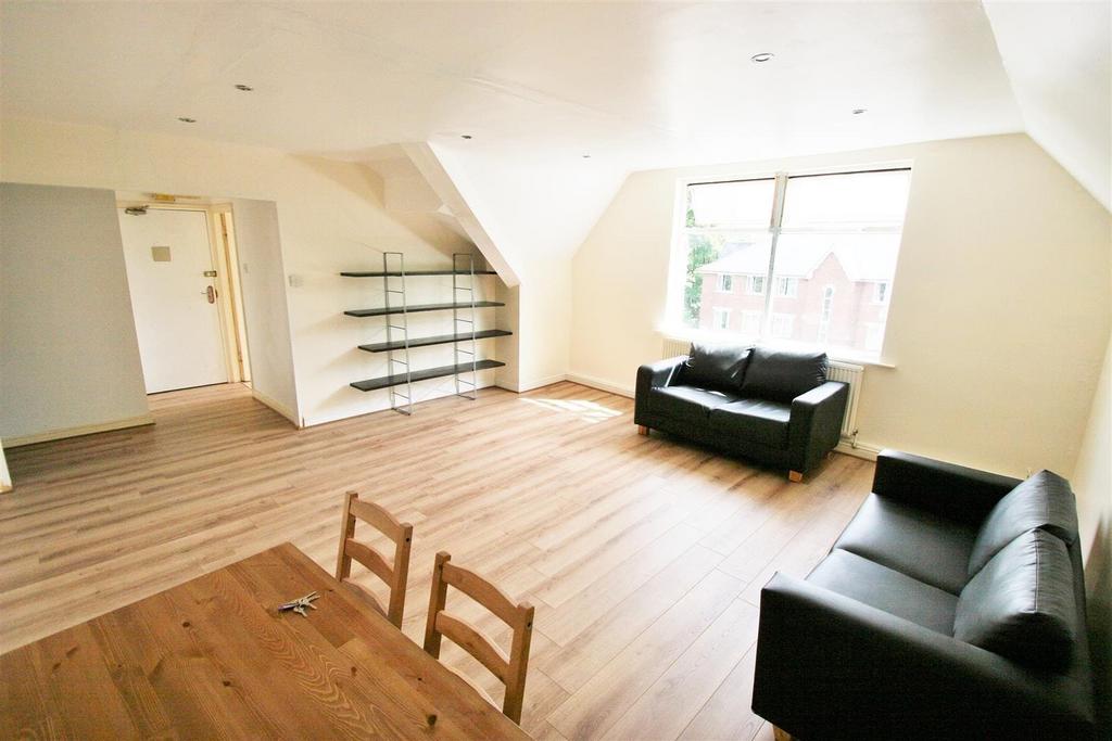 Bright and spacious living room with large wind...