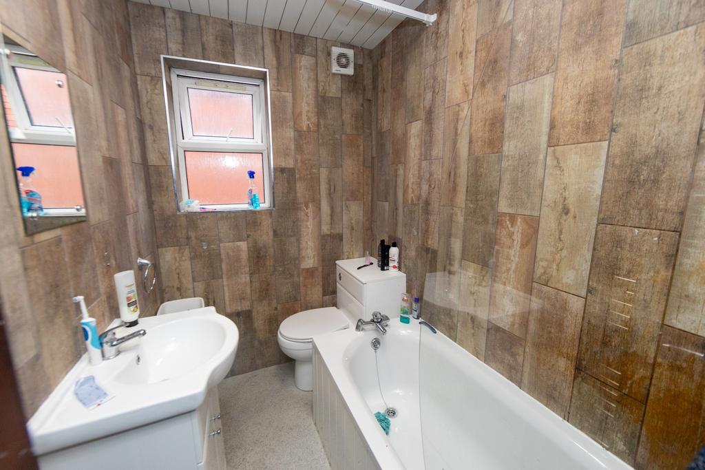 Bright and functional bathroom with a bathtub, ...
