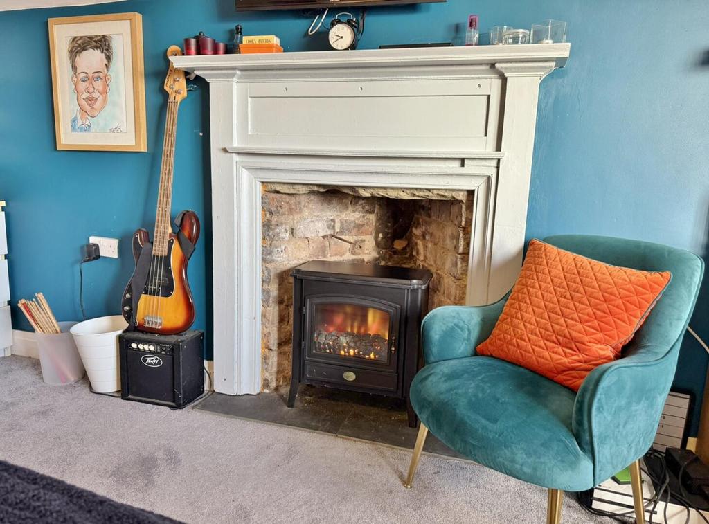 Bedroom 5 fireplace with electric stove