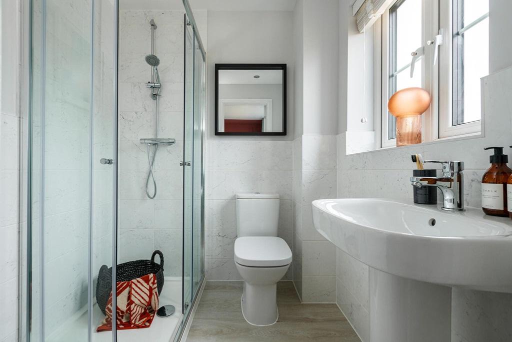 Bedroom 1 boasts an en-suite shower room