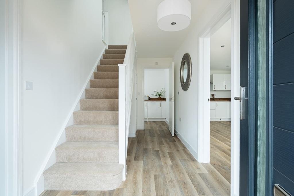The central entrance hall is light and bright