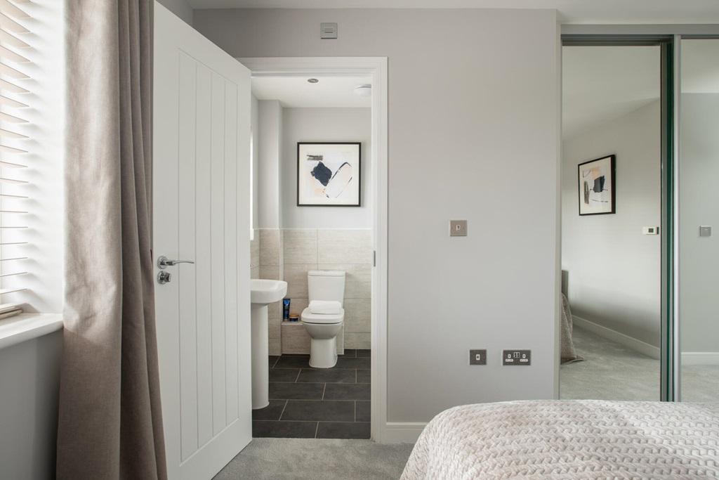 The main bedroom boasts an en suite shower room