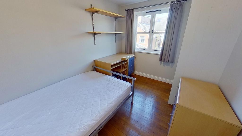 Bright, neatly presented bedroom with wooden fl...