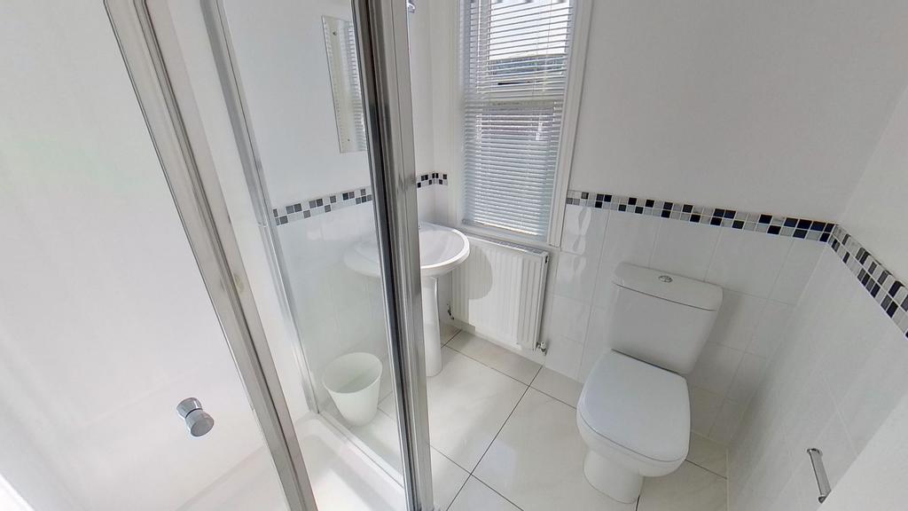 Bright, modern bathroom with a walk-in shower, ...