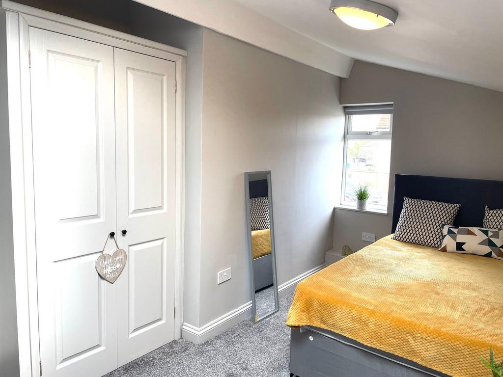 Bright and inviting master bedroom featuring a ...