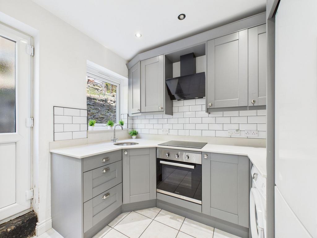 A modern, well-maintained kitchen featuring sle...