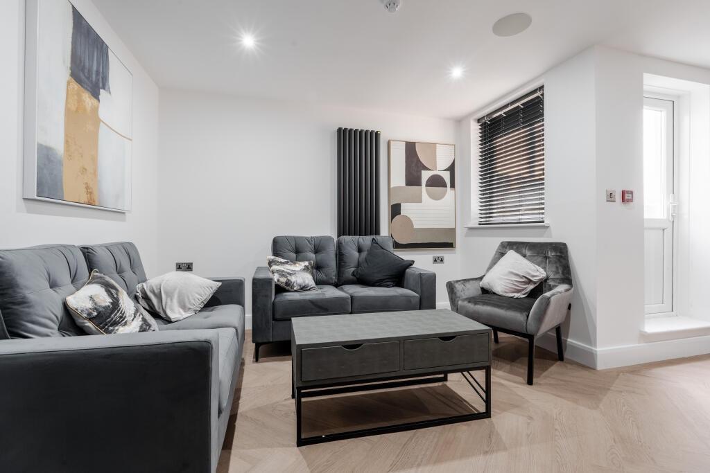 A modern and inviting living room featuring com...