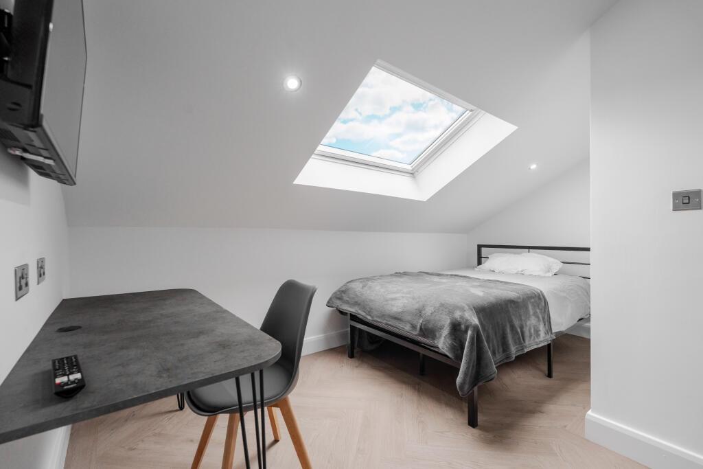 A bright and neatly presented double bedroom fe...