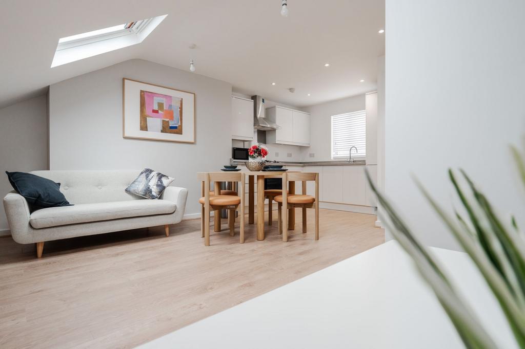 A bright and airy living room featuring a moder...