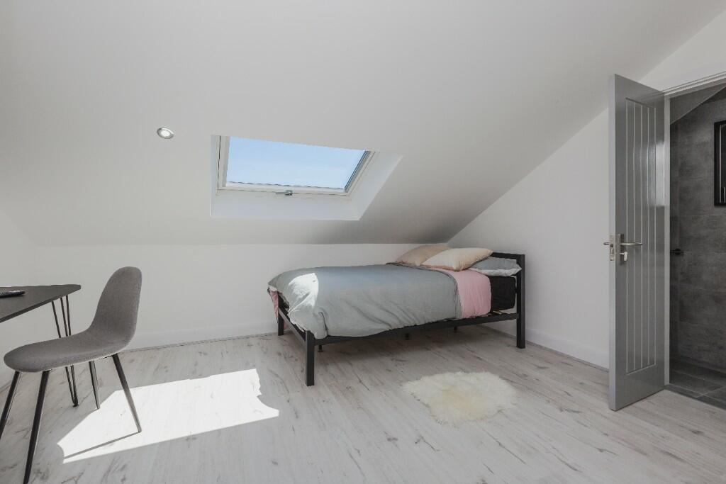 A clean and well-lit small bathroom with a visi...