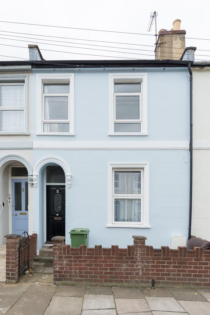 Well-presented terraced house with a pale blue ...