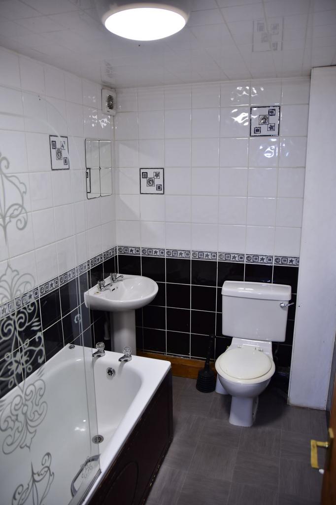A clean, well-maintained bathroom with a standa...