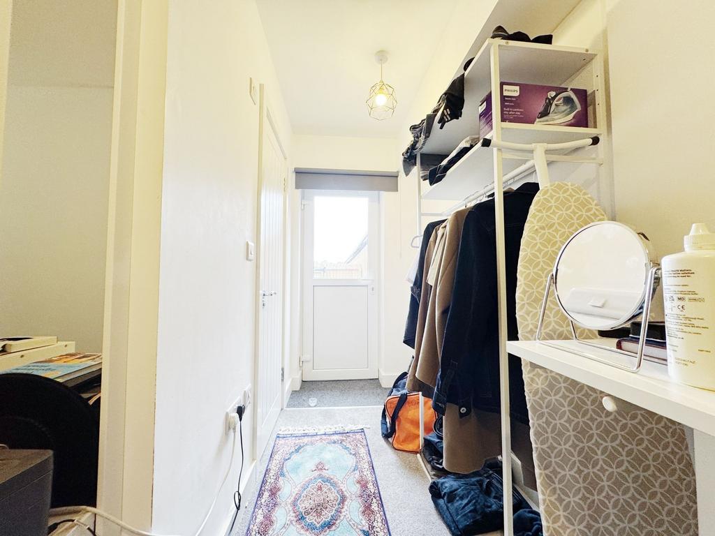 Bright, tidy entrance hall with a coated floor ...