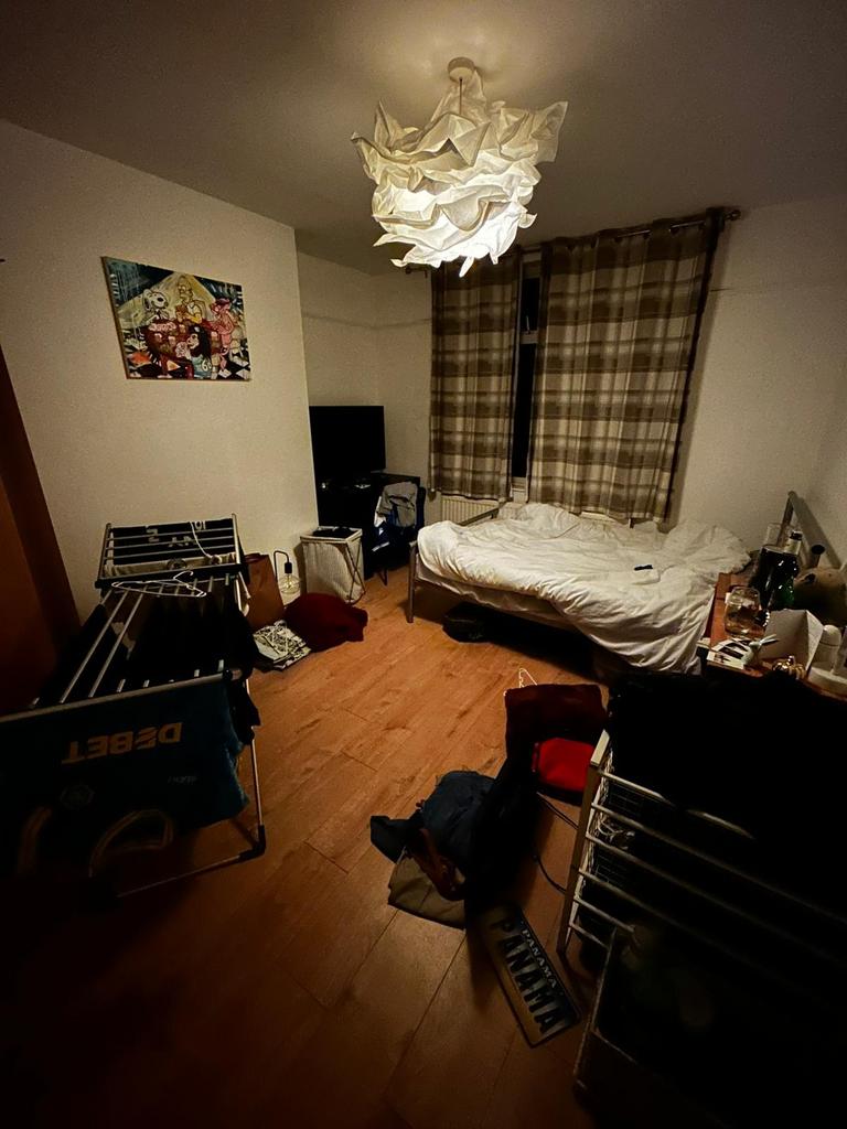 Cozy double bedroom with warm wooden flooring, ...