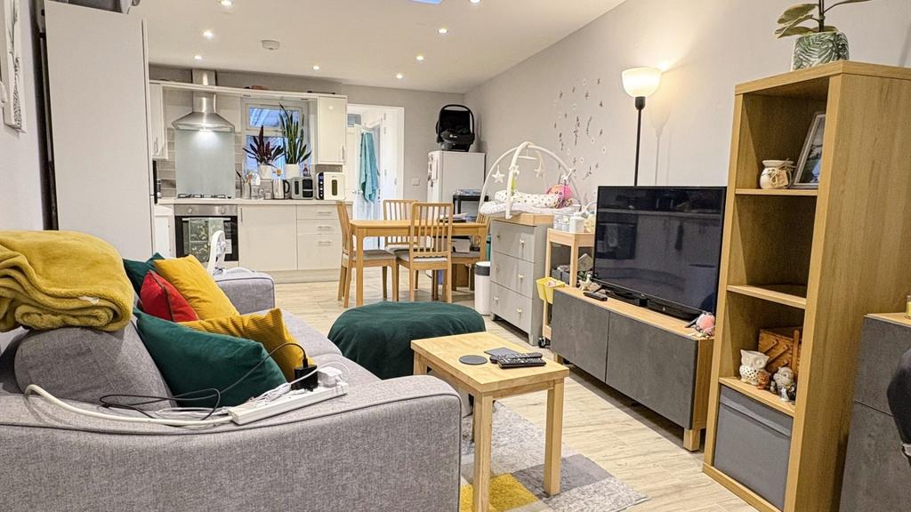 Bright, modern open-plan living area with comfo...