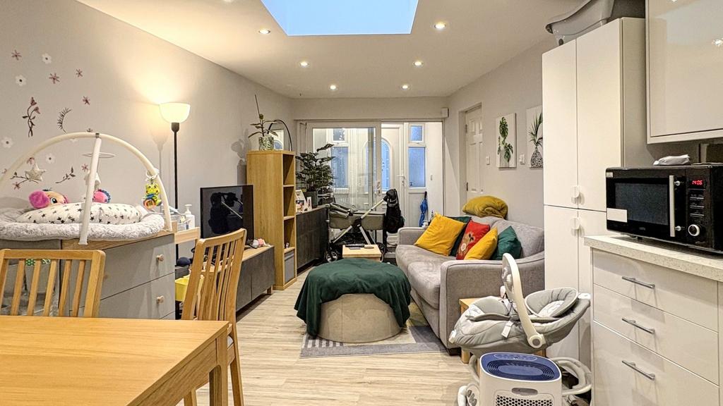 Bright, modern open-plan living area with a com...