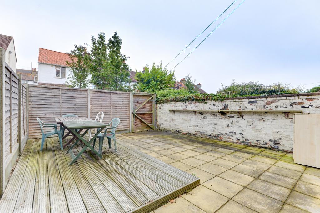 Private paved and decked rear garden with outdo...