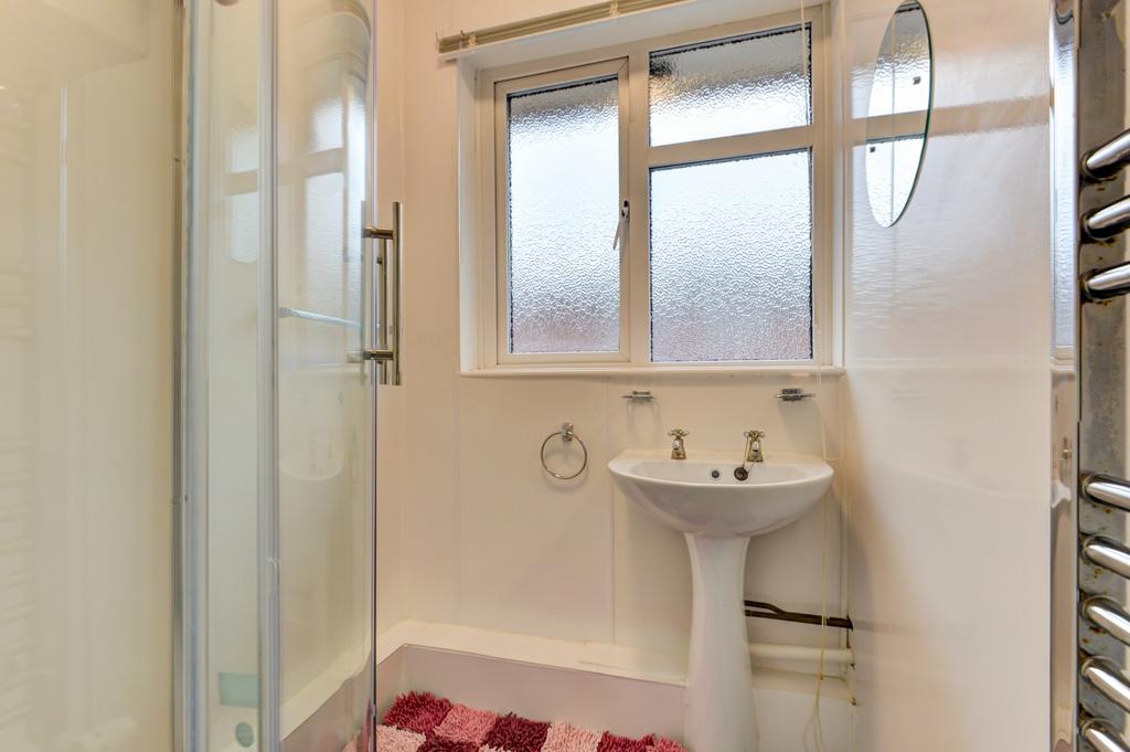 Bright, well-kept bathroom featuring a modern c...